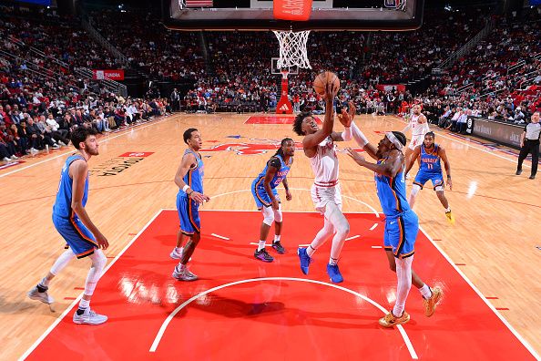 HOUSTON, TX - DECEMBER 6:   Jalen Green #4 of the Houston Rockets drives to the basket during the game against the Oklahoma City Thunder on December 6, 2023 at the Toyota Center in Houston, Texas. NOTE TO USER: User expressly acknowledges and agrees that, by downloading and or using this photograph, User is consenting to the terms and conditions of the Getty Images License Agreement. Mandatory Copyright Notice: Copyright 2023 NBAE (Photo by Michael Gonzales/NBAE via Getty Images)