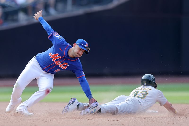 Aug 15, 2024; New York City, New York, USA; Oakland Athletics center fielder JJ Bleday (33) steals second base ahead of the tag by New York Mets second baseman Jose Iglesias (11) during the ninth inning at Citi Field. Mandatory Credit: Brad Penner-USA TODAY Sports