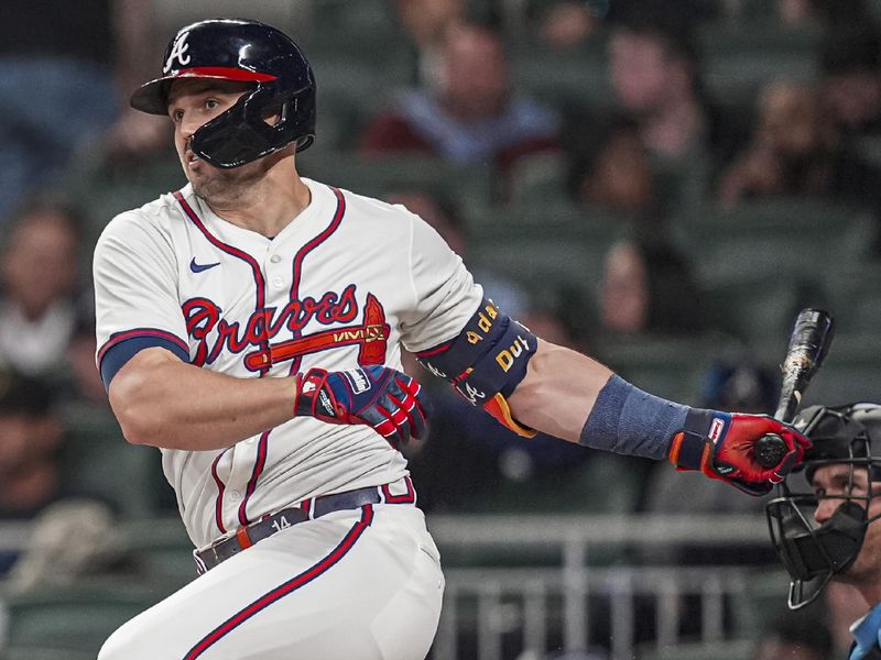 Apr 23, 2024; Cumberland, Georgia, USA; Atlanta Braves outfielder Adam Duvall (14) singles against the Miami Marlins during the eighth inning at Truist Park. Mandatory Credit: Dale Zanine-USA TODAY Sports