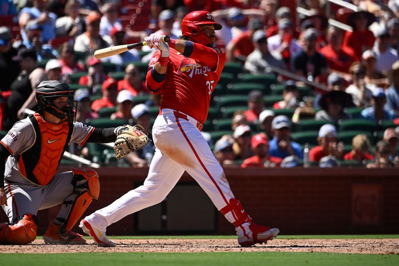 Jun 23, 2024; St. Louis, Missouri, USA; St. Louis Cardinals third baseman Brandon Crawford (35) hits a RBI double in the eighth inning against the San Francisco Giants at Busch Stadium. Mandatory Credit: Joe Puetz-USA TODAY Sports