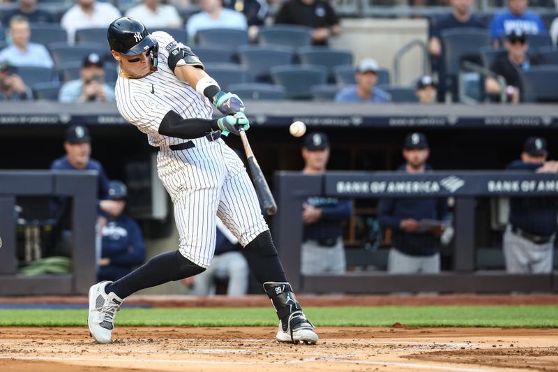 May 22, 2024; Bronx, New York, USA;  New York Yankees center fielder Aaron Judge (99) hits a two run home run in the first inning against the Seattle Mariners at Yankee Stadium. Mandatory Credit: Wendell Cruz-USA TODAY Sports