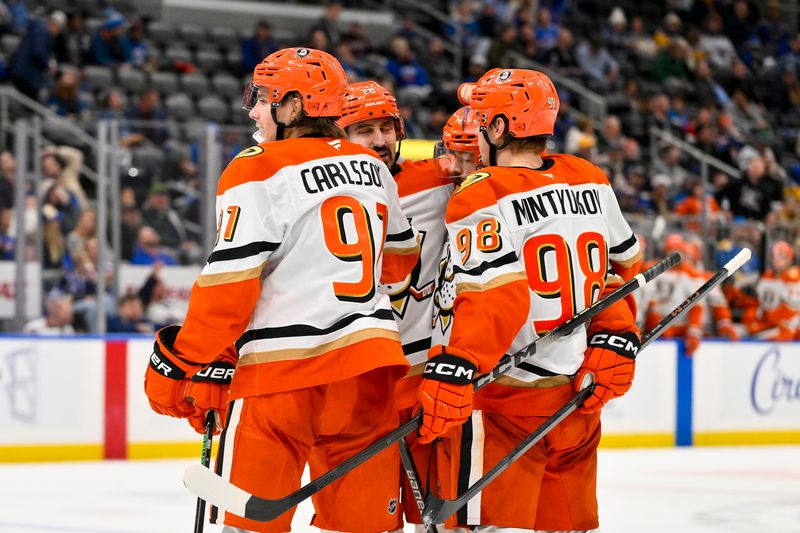 Dec 1, 2025; St. Louis, Missouri, USA; Anaheim Ducks center Leo Carlsson (91) is congratulated by teammates after scoring against the St. Louis Blues during the third period at Enterprise Center. Mandatory Credit: Jeff Curry-Imagn Images