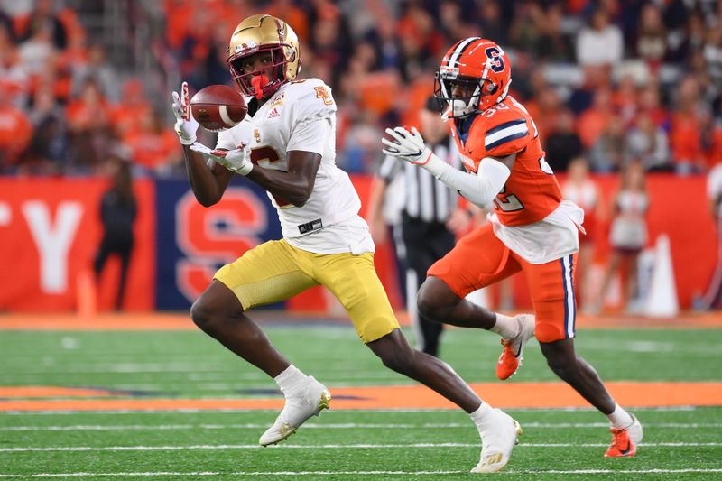 Nov 3, 2023; Syracuse, New York, USA; Boston College Eagles wide receiver Jaden Skeete (6) catches the ball as Syracuse Orange defensive back Gregory Elaine (32) defends during the second half at the JMA Wireless Dome. Mandatory Credit: Rich Barnes-USA TODAY Sports