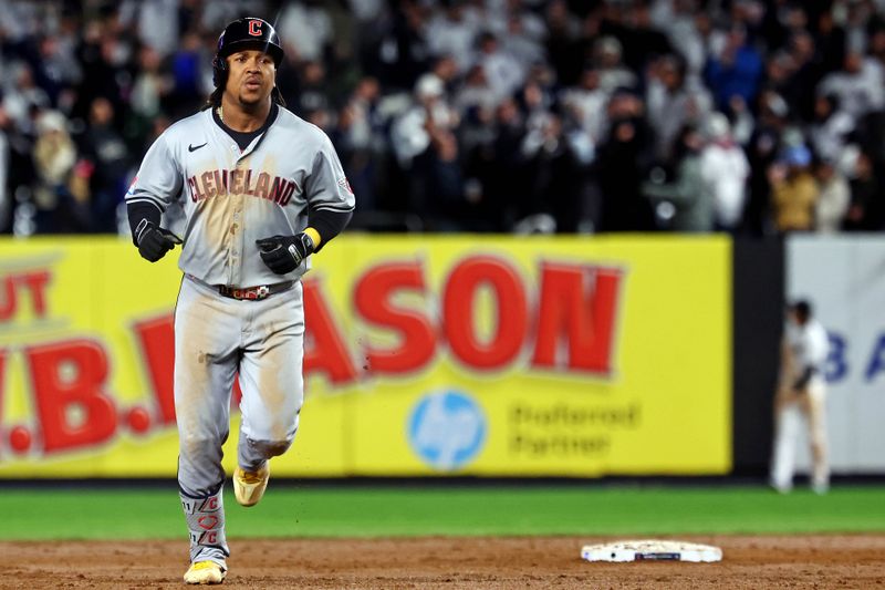 Oct 15, 2024; Bronx, New York, USA; Cleveland Guardians third base José Ramírez (11) runs the bases after hitting a two run home run during the ninth inning against the New York Yankees in game two of the ALCS for the 2024 MLB Playoffs at Yankee Stadium. Mandatory Credit: Vincent Carchietta-Imagn Images