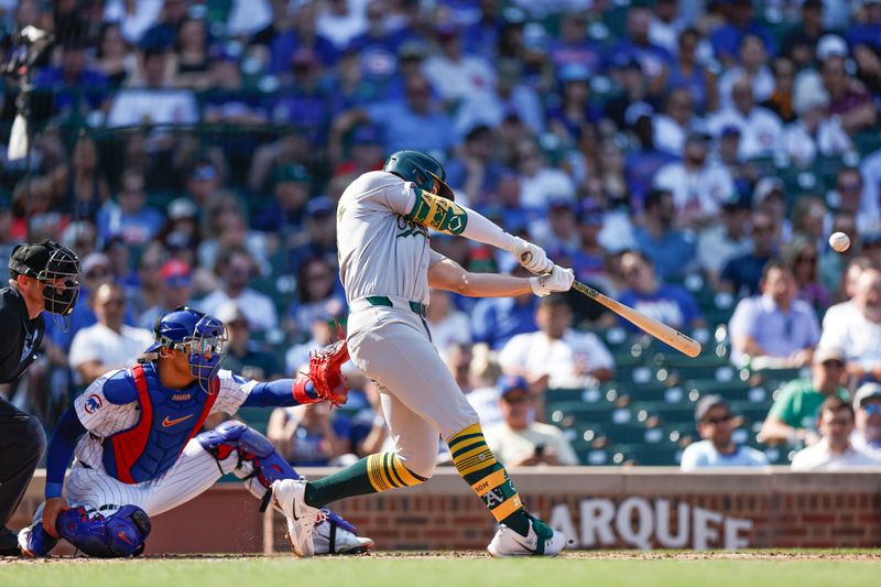 Sep 18, 2024; Chicago, Illinois, USA; Oakland Athletics first baseman Tyler Soderstrom (21) hits a solo home run against the Chicago Cubs during the fourth inning at Wrigley Field. Mandatory Credit: Kamil Krzaczynski-Imagn Images