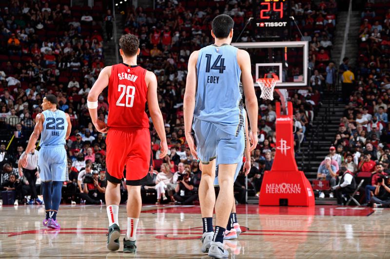 HOUSTON, TX - OCTOBER 25: Alperen Sengun #28 of the Houston Rockets and Zach Edey #14 of the Memphis Grizzlies look on during the game on October 25, 2024 at the Toyota Center in Houston, Texas. NOTE TO USER: User expressly acknowledges and agrees that, by downloading and or using this photograph, User is consenting to the terms and conditions of the Getty Images License Agreement. Mandatory Copyright Notice: Copyright 2024 NBAE (Photo by Logan Riely/NBAE via Getty Images)