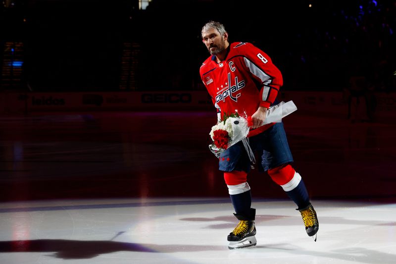 Mar 24, 2024; Washington, District of Columbia, USA; Washington Capitals left wing Alex Ovechkin (8) skates on the ice during a celebration honoring Washington Capitals right wing T.J. Oshie (not pictured) 1,000 NHL regular-season game prior to the game against the Winnipeg Jets at Capital One Arena. Mandatory Credit: Amber Searls-USA TODAY Sports