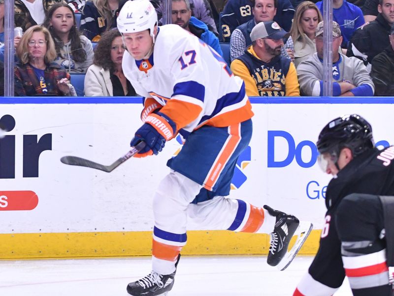 Oct 21, 2023; Buffalo, New York, USA; New York Islanders left wing Matt Martin (17) takes a shot against the Buffalo Sabres in the first period against the New York Islanders at KeyBank Center. Mandatory Credit: Mark Konezny-USA TODAY Sports