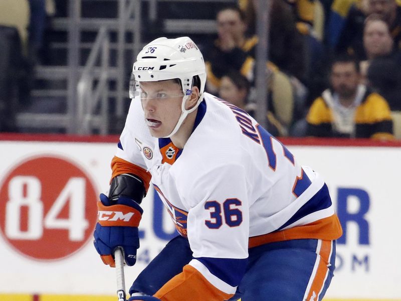 Mar 9, 2023; Pittsburgh, Pennsylvania, USA;  New York Islanders left wing Otto Koivula (36) moves the puck up ice against the Pittsburgh Penguins during the second period at PPG Paints Arena. Mandatory Credit: Charles LeClaire-USA TODAY Sports