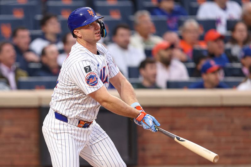 May 27, 2025; New York City, New York, USA; New York Mets first baseman Pete Alonso (20) hits a two run home run during the first inning against the Chicago White Sox at Citi Field. Mandatory Credit: Vincent Carchietta-Imagn Images