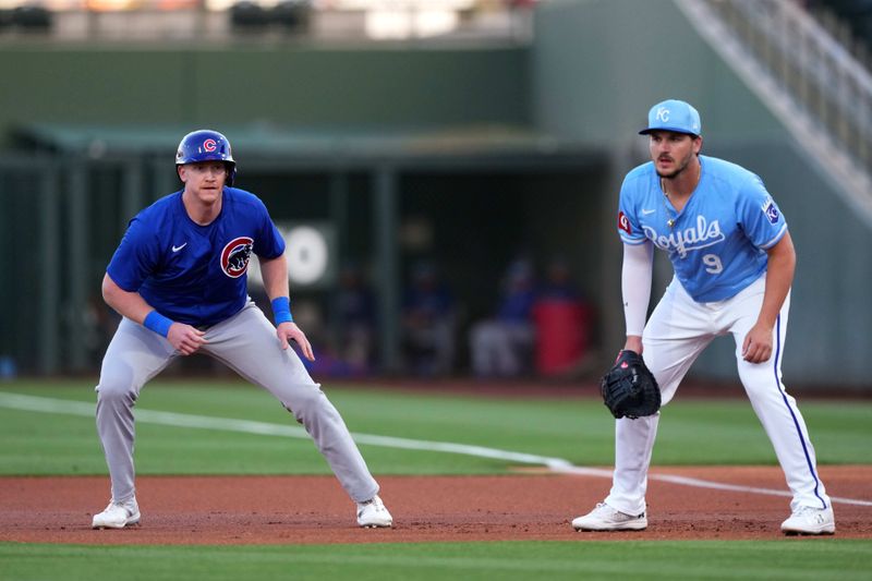 Mar 5, 2024; Surprise, Arizona, USA; Chicago Cubs first baseman Garrett Cooper (41) leads off first base as Kansas City Royals first baseman Vinnie Pasquantino (9) covers the bag during the first inning at Surprise Stadium. Mandatory Credit: Joe Camporeale-USA TODAY Sports