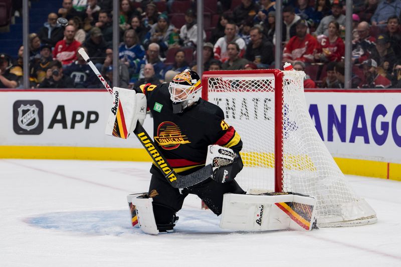 Feb 13, 2023; Vancouver, British Columbia, CAN; Vancouver Canucks goalie Collin Delia (60) makes a save against the Detroit Red Wings in the second period at Rogers Arena. Mandatory Credit: Bob Frid-USA TODAY Sports