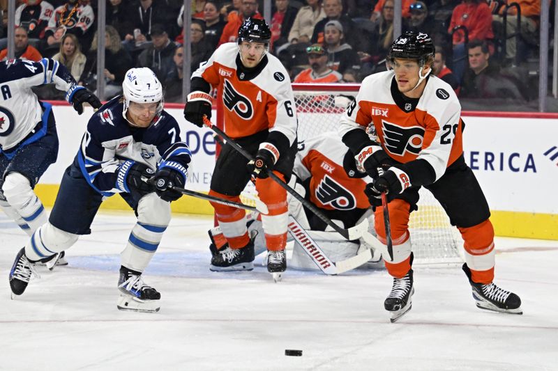 Oct 16, 2025; Philadelphia, Pennsylvania, USA; Winnipeg Jets center Vladislav Namestnikov (7) and Philadelphia Flyers right wing Nikita Grebenkin (29) battle for the puck during the first period at Wells Fargo Center. Mandatory Credit: Eric Hartline-Imagn Images