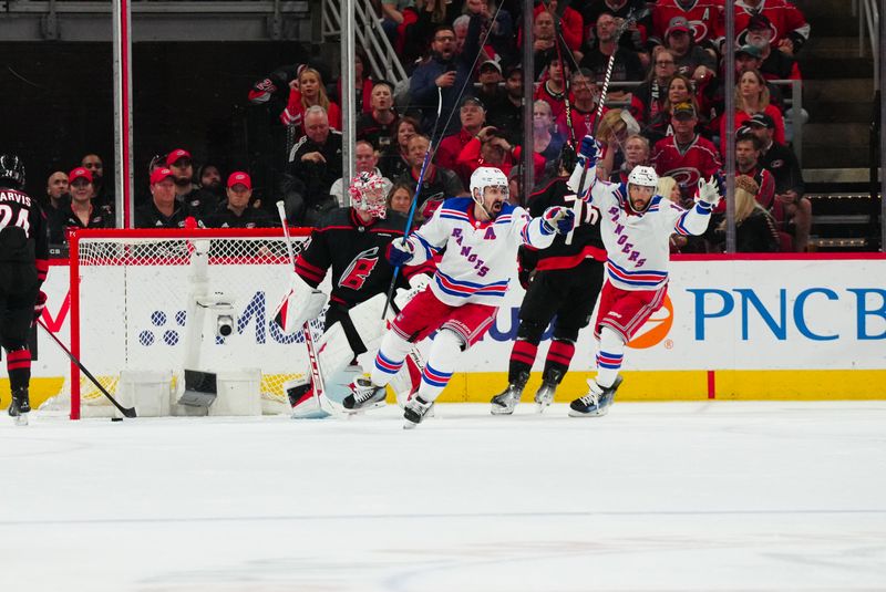 May 16, 2024; Raleigh, North Carolina, USA; New York Rangers left wing Chris Kreider (20) celebrates his goal against the Carolina Hurricanes during the third period in game six of the second round of the 2024 Stanley Cup Playoffs at PNC Arena. Mandatory Credit: James Guillory-USA TODAY Sports