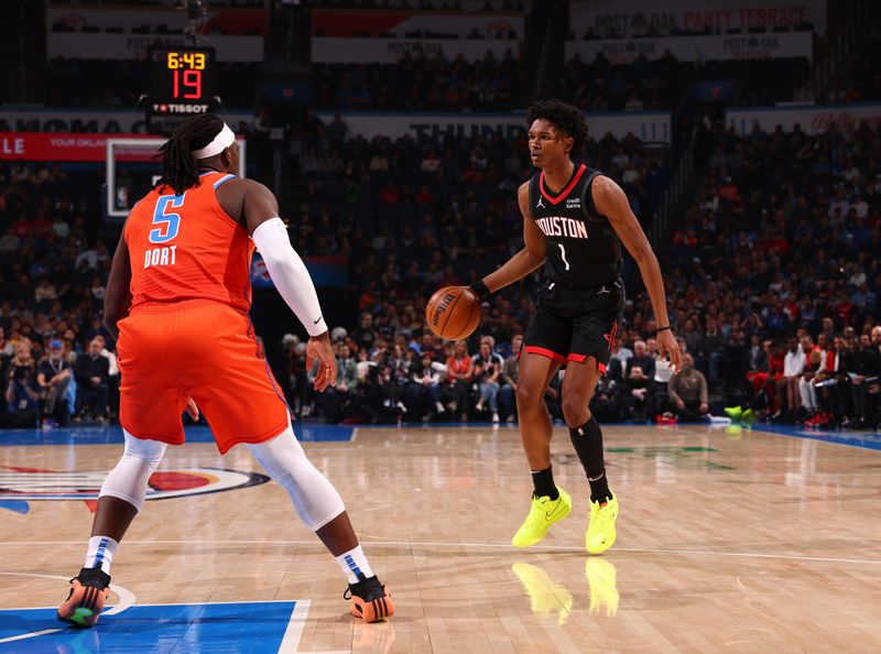 OKLAHOMA CITY, OK - MARCH 27:  Amen Thompson #1 of the Houston Rockets handles the ball during the game against the Oklahoma City Thunder on March 27, 2024 at Paycom Arena in Oklahoma City, Oklahoma. NOTE TO USER: User expressly acknowledges and agrees that, by downloading and or using this photograph, User is consenting to the terms and conditions of the Getty Images License Agreement. Mandatory Copyright Notice: Copyright 2024 NBAE (Photo by Zach Beeker/NBAE via Getty Images)