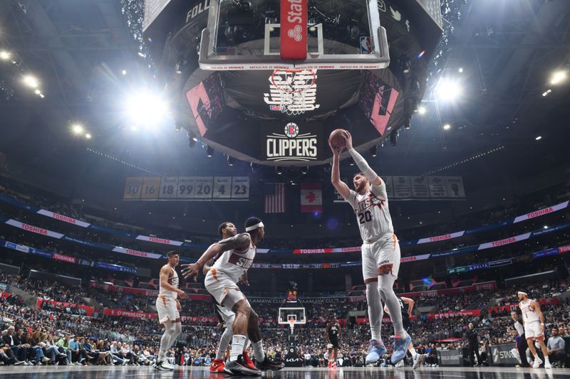 LOS ANGELES, CA - APRIL 10: Jusuf Nurkic #20 of the Phoenix Suns rebounds the ball during the game against the LA Clippers on April 10, 2024 at Crypto.Com Arena in Los Angeles, California. NOTE TO USER: User expressly acknowledges and agrees that, by downloading and/or using this Photograph, user is consenting to the terms and conditions of the Getty Images License Agreement. Mandatory Copyright Notice: Copyright 2024 NBAE (Photo by Adam Pantozzi/NBAE via Getty Images)