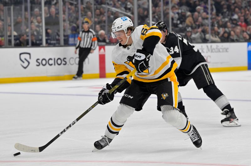 Feb 11, 2023; Los Angeles, California, USA;  Pittsburgh Penguins right wing Rickard Rakell (67) takes the puck down ice in the third period against the Los Angeles Kings at Crypto.com Arena.  Mandatory Credit: Jayne Kamin-Oncea-USA TODAY Sports