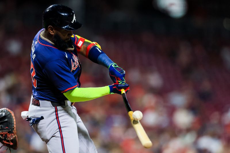 Sep 18, 2024; Cincinnati, Ohio, USA; Atlanta Braves designated hitter Marcell Ozuna (20) hits a RBI double in the eighth inning against the Cincinnati Reds at Great American Ball Park. Mandatory Credit: Katie Stratman-Imagn Images