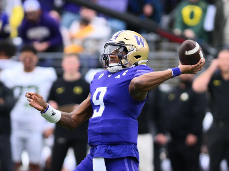 Oct 14, 2023; Seattle, Washington, USA; Washington Huskies quarterback Michael Penix Jr. (9) passes the ball against the Oregon Ducks during the first half at Alaska Airlines Field at Husky Stadium. Mandatory Credit: Steven Bisig-USA TODAY Sports