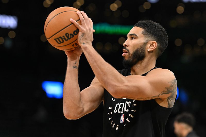 BOSTON, MASSACHUSETTS - OCTOBER 28: Jayson Tatum #0 of the Boston Celtics takes a shot before a game against the Milwaukee Bucks at the TD Garden on October 28, 2024 in Boston, Massachusetts. NOTE TO USER: User expressly acknowledges and agrees that, by downloading and or using this photograph, User is consenting to the terms and conditions of the Getty Images License Agreement. (Photo by Brian Fluharty/Getty Images)