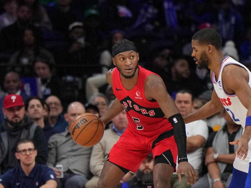 PHILADELPHIA, PA - FEBRUARY 11: Immanuel Quickley #5 of the Toronto Raptors dribbles the ball during the game against the Philadelphia 76ers  on February 11, 2025 at the Wells Fargo Center in Philadelphia, Pennsylvania NOTE TO USER: User expressly acknowledges and agrees that, by downloading and/or using this Photograph, user is consenting to the terms and conditions of the Getty Images License Agreement. Mandatory Copyright Notice: Copyright 2025 NBAE (Photo by Jesse D. Garrabrant/NBAE via Getty Images)