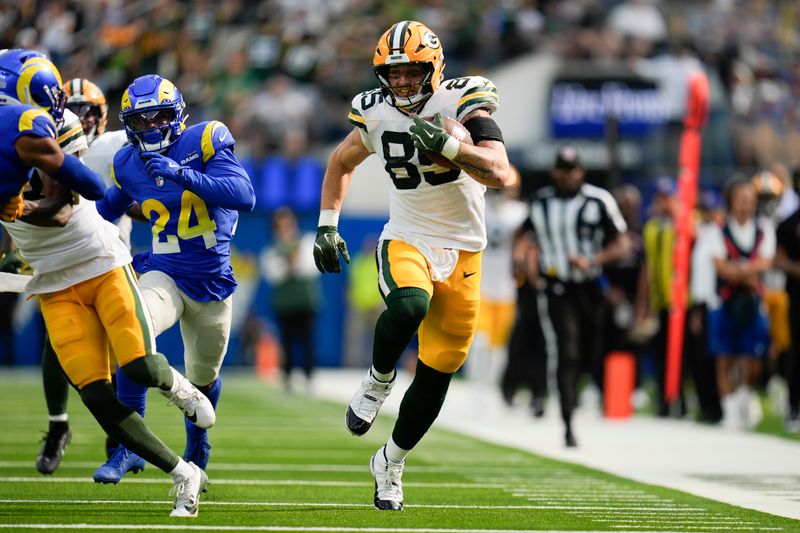 Green Bay Packers tight end Tucker Kraft (85) runs for a touchdown during the second half of an NFL football game against the Los Angeles Rams Sunday, Oct. 6, 2024, in Inglewood, Calif. (AP Photo/Gregory Bull)