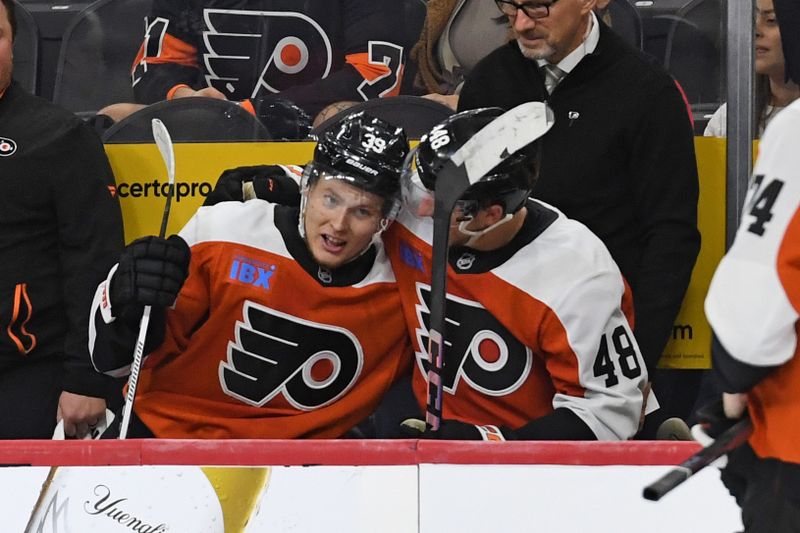 Sep 26, 2024; Philadelphia, Pennsylvania, USA; Philadelphia Flyers right wing Matvei Michkov (39) celebrates his goal with center Morgan Frost (48) against the New York Islanders during the third period at Wells Fargo Center. Mandatory Credit: Eric Hartline-Imagn Images