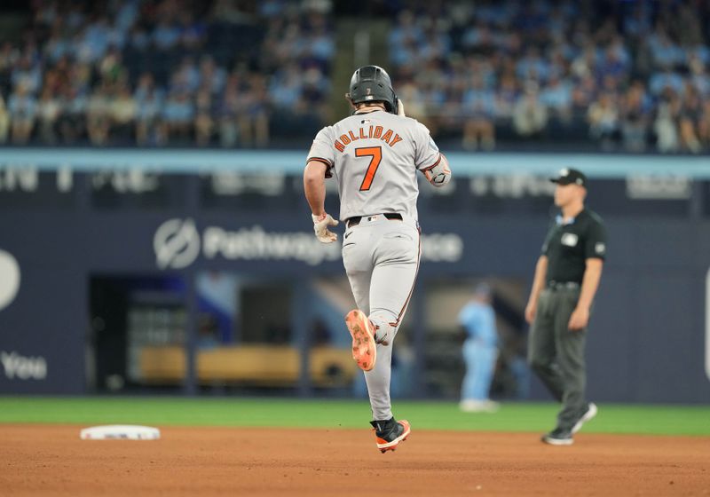 Aug 7, 2024; Toronto, Ontario, CAN; Baltimore Orioles second baseman Jackson Holliday (7) runs the bases after hitting a two run home run against the Toronto Blue Jays during the seventh inning at Rogers Centre. Mandatory Credit: Nick Turchiaro-USA TODAY Sports