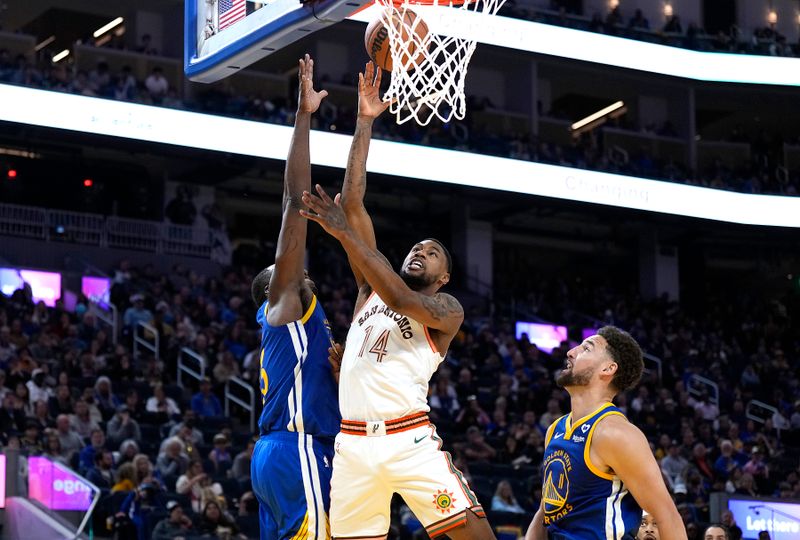 SAN FRANCISCO, CALIFORNIA - MARCH 09: Blake Wesley #14 of the San Antonio Spurs shoots over Draymond Green #23 of the Golden State Warriors during the third quarter at Chase Center on March 09, 2024 in San Francisco, California. NOTE TO USER: User expressly acknowledges and agrees that, by downloading and or using this photograph, User is consenting to the terms and conditions of the Getty Images License Agreement. (Photo by Thearon W. Henderson/Getty Images)