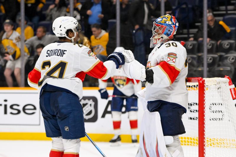 Feb 25, 2025; Nashville, Tennessee, USA;  Florida Panthers right wing Justin Sourdif (24) congratulates goaltender Spencer Knight (30) for the win against the Nashville Predators during the third half at Bridgestone Arena. Mandatory Credit: Steve Roberts-Imagn Images