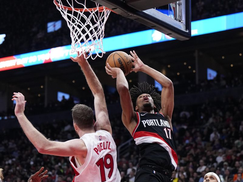 TORONTO, ON - OCTOBER 30: Shaedon Sharpe #17 of the Portland Trail Blazers goes to the basket against Jakob Poeltl #19 of the Toronto Raptors during the first half of the game at the Scotiabank Arena on October 30, 2023 in Toronto, Ontario, Canada. NOTE TO USER: User expressly acknowledges and agrees that, by downloading and/or using this Photograph, user is consenting to the terms and conditions of the Getty Images License Agreement. (Photo by Mark Blinch/Getty Images)