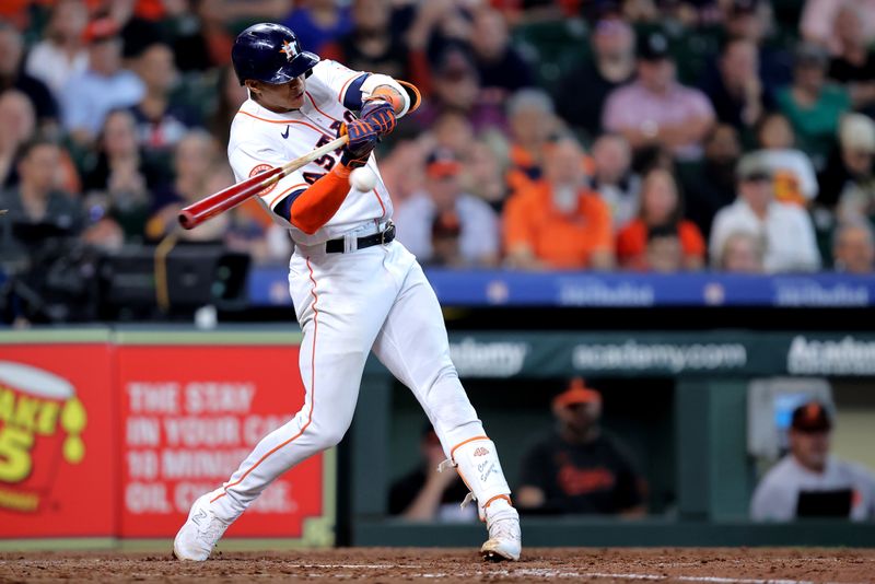 Sep 20, 2023; Houston, Texas, USA; Houston Astros shortstop Jeremy Pena (3) hits an RBI double against the Baltimore Orioles during the eighth inning at Minute Maid Park. Mandatory Credit: Erik Williams-USA TODAY Sports