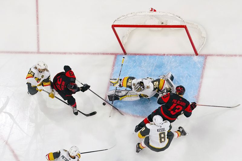 Mar 11, 2023; Raleigh, North Carolina, USA; Vegas Golden Knights goaltender Jonathan Quick (32) stops the scoring attempt by Carolina Hurricanes right wing Stefan Noesen (23) during the first period at PNC Arena. Mandatory Credit: James Guillory-USA TODAY Sports