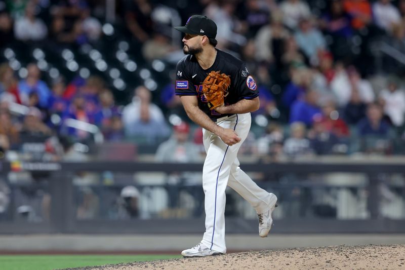 Sep 20, 2024; New York City, New York, USA; New York Mets relief pitcher Eddy Alvarez (26) follows through on a pitch against the Philadelphia Phillies during the ninth inning at Citi Field. Mandatory Credit: Brad Penner-Imagn Images