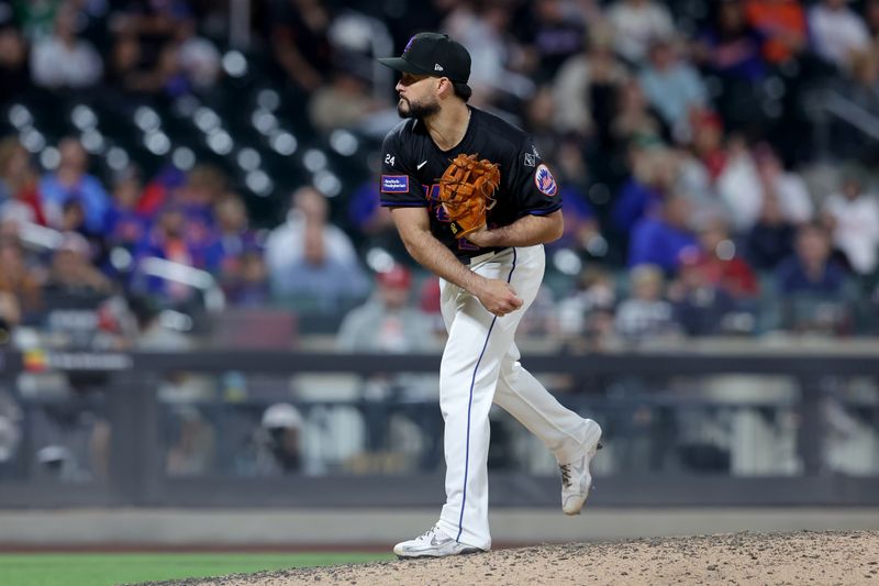 Sep 20, 2024; New York City, New York, USA; New York Mets relief pitcher Eddy Alvarez (26) follows through on a pitch against the Philadelphia Phillies during the ninth inning at Citi Field. Mandatory Credit: Brad Penner-Imagn Images