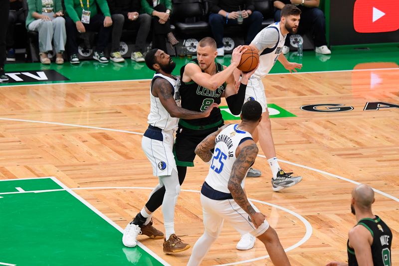 BOSTON, MA - JUNE 9: Kristaps Porzingis #8 of the Boston Celtics handles the ball during the game against the Dallas Mavericks during Game 2 of the 2024 NBA Finals on June 9, 2024 at the TD Garden in Boston, Massachusetts. NOTE TO USER: User expressly acknowledges and agrees that, by downloading and or using this photograph, User is consenting to the terms and conditions of the Getty Images License Agreement. Mandatory Copyright Notice: Copyright 2024 NBAE  (Photo by Brian Babineau/NBAE via Getty Images)