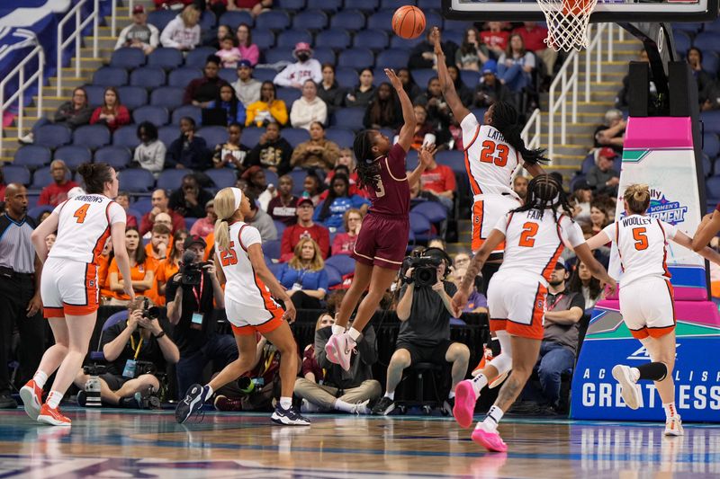 Mar 8, 2024; Greensboro, NC, USA; Florida State Seminoles guard O'Mariah Gordon (3) shoots the ball over Syracuse Orange forward Alyssa Latham (23) in the first half at Greensboro Coliseum. Mandatory Credit: David Yeazell-USA TODAY Sports