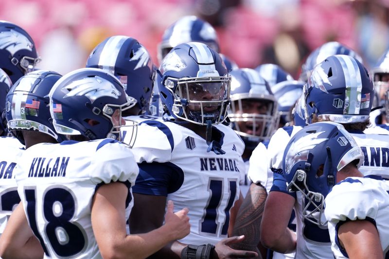 Sep 2, 2023; Los Angeles, California, USA; Nevada Wolf Pack players huddle before the game against the Southern California Trojans at United Airlines Field at Los Angeles Memorial Coliseum. Mandatory Credit: Kirby Lee-USA TODAY Sports