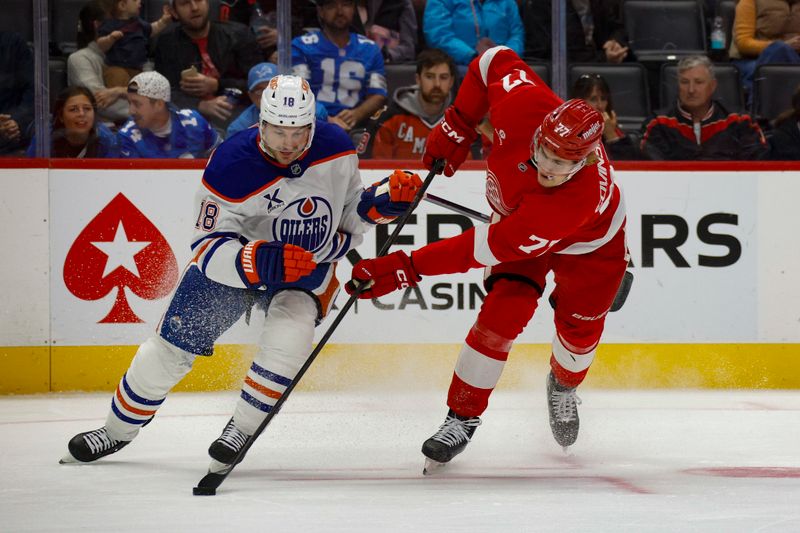 Oct 27, 2024; Detroit, Michigan, USA; Edmonton Oilers left wing Zach Hyman (18) fights for control of the puck with Detroit Red Wings defenseman Simon Edvinsson (77) during the first period at Little Caesars Arena. Mandatory Credit: Brian Bradshaw Sevald-Imagn Images