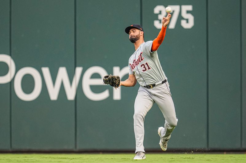 Jun 17, 2024; Cumberland, Georgia, USA; Detroit Tigers center fielder Riley Greene (31) throws the ball after fielding a double hit by Atlanta Braves third baseman Austin Riley (27) (not shown) during the second inning at Truist Park. Mandatory Credit: Dale Zanine-USA TODAY Sports