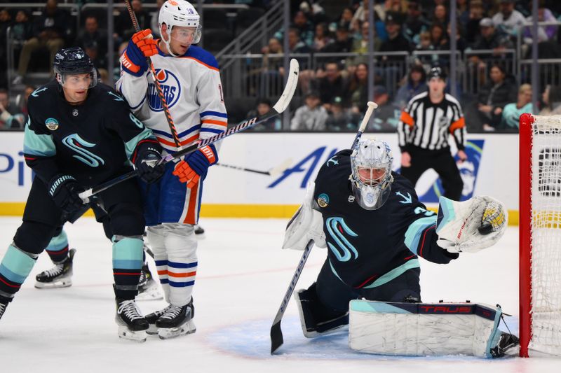 Mar 2, 2024; Seattle, Washington, USA; Seattle Kraken goaltender Philipp Grubauer (31) blocks a goal shot against the Edmonton Oilers during the first period at Climate Pledge Arena. Mandatory Credit: Steven Bisig-USA TODAY Sports