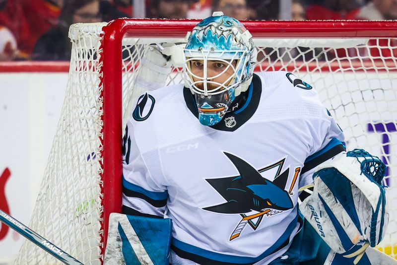 Apr 18, 2024; Calgary, Alberta, CAN; San Jose Sharks goaltender Georgi Romanov (31) guards his net against Calgary Flames during the second period at Scotiabank Saddledome. Mandatory Credit: Sergei Belski-USA TODAY Sports