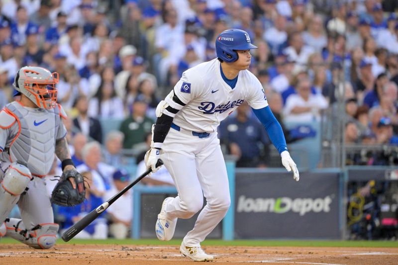 Oct 20, 2024; Los Angeles, California, USA; Los Angeles Dodgers designated hitter Shohei Ohtani (17) runs to first after hitting a single in the first inning against the New York Mets during game six of the NLCS for the 2024 MLB playoffs at Dodger Stadium. Mandatory Credit: Jayne Kamin-Oncea-Imagn Images