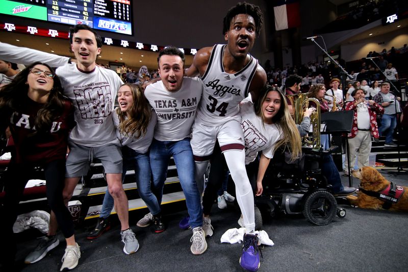 Jan 18, 2023; College Station, Texas, USA; Texas A&M Aggies forward Julius Marble (34) celebrates with the students after the 54-52 win over the Florida Gators at Reed Arena. Mandatory Credit: Erik Williams-USA TODAY Sports
