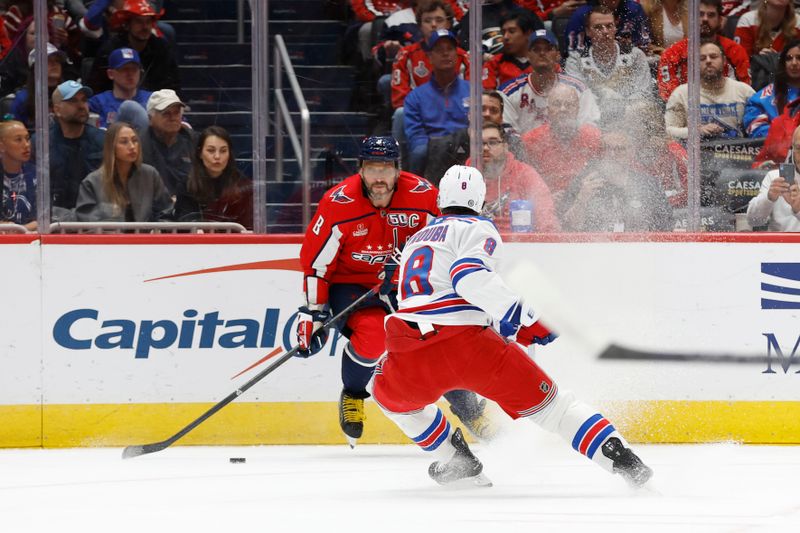 Oct 29, 2024; Washington, District of Columbia, USA; Washington Capitals left wing Alex Ovechkin (8)skates with the puck as New York Rangers defenseman Jacob Trouba (8) defends in the first period at Capital One Arena. Mandatory Credit: Geoff Burke-Imagn Images