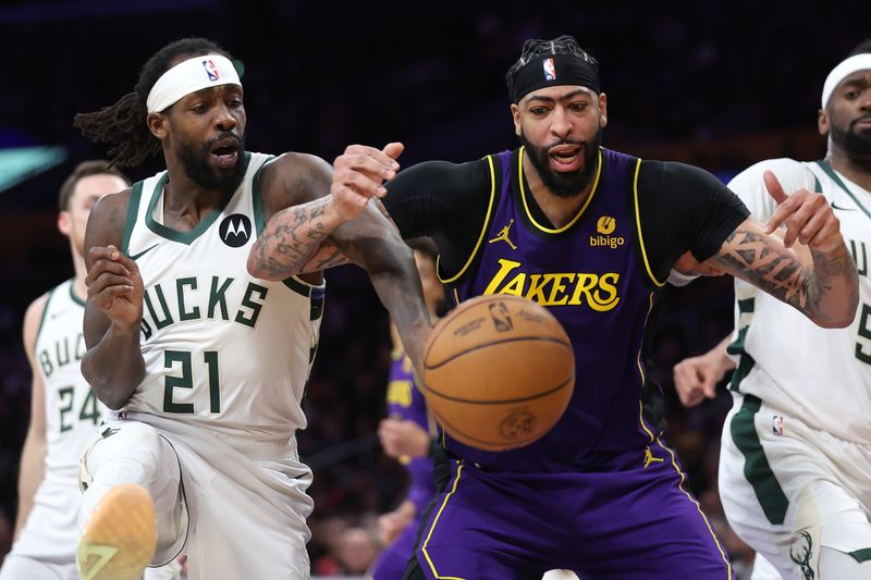 LOS ANGELES, CALIFORNIA - MARCH 08: Anthony Davis #3 of the Los Angeles Lakers and Patrick Beverley #21 of the Milwaukee Bucks battle for a rebound during the second half of a game at Crypto.com Arena on March 08, 2024 in Los Angeles, California. (Photo by Sean M. Haffey/Getty Images)