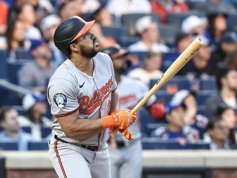 Aug 20, 2024; New York City, New York, USA;  Baltimore Orioles right fielder Anthony Santander (25) hits a two-run home run in the first inning against the New York Mets at Citi Field. Mandatory Credit: Wendell Cruz-USA TODAY Sports