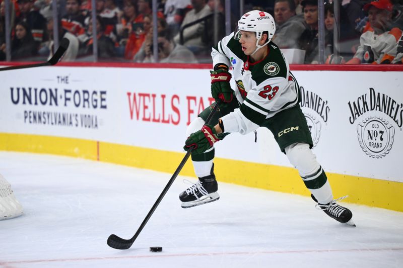 Oct 26, 2024; Philadelphia, Pennsylvania, USA; Minnesota Wild center Marco Rossi (23) controls the puck against the Philadelphia Flyers in the first period at Wells Fargo Center. Mandatory Credit: Kyle Ross-Imagn Images