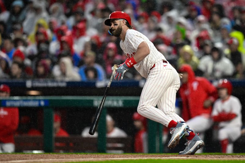 May 4, 2024; Philadelphia, Pennsylvania, USA; Philadelphia Phillies first baseman Bryce Harper (3) hits a single against the San Francisco Giants during the first inning at Citizens Bank Park. Mandatory Credit: John Jones-USA TODAY Sports