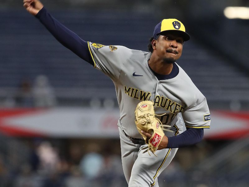 May 22, 2025; Pittsburgh, Pennsylvania, USA;  Milwaukee Brewers relief pitcher  Carlos Rodriguez (00) pitches against the Pittsburgh Pirates during the fifth inning at PNC Park. Mandatory Credit: Charles LeClaire-Imagn Images